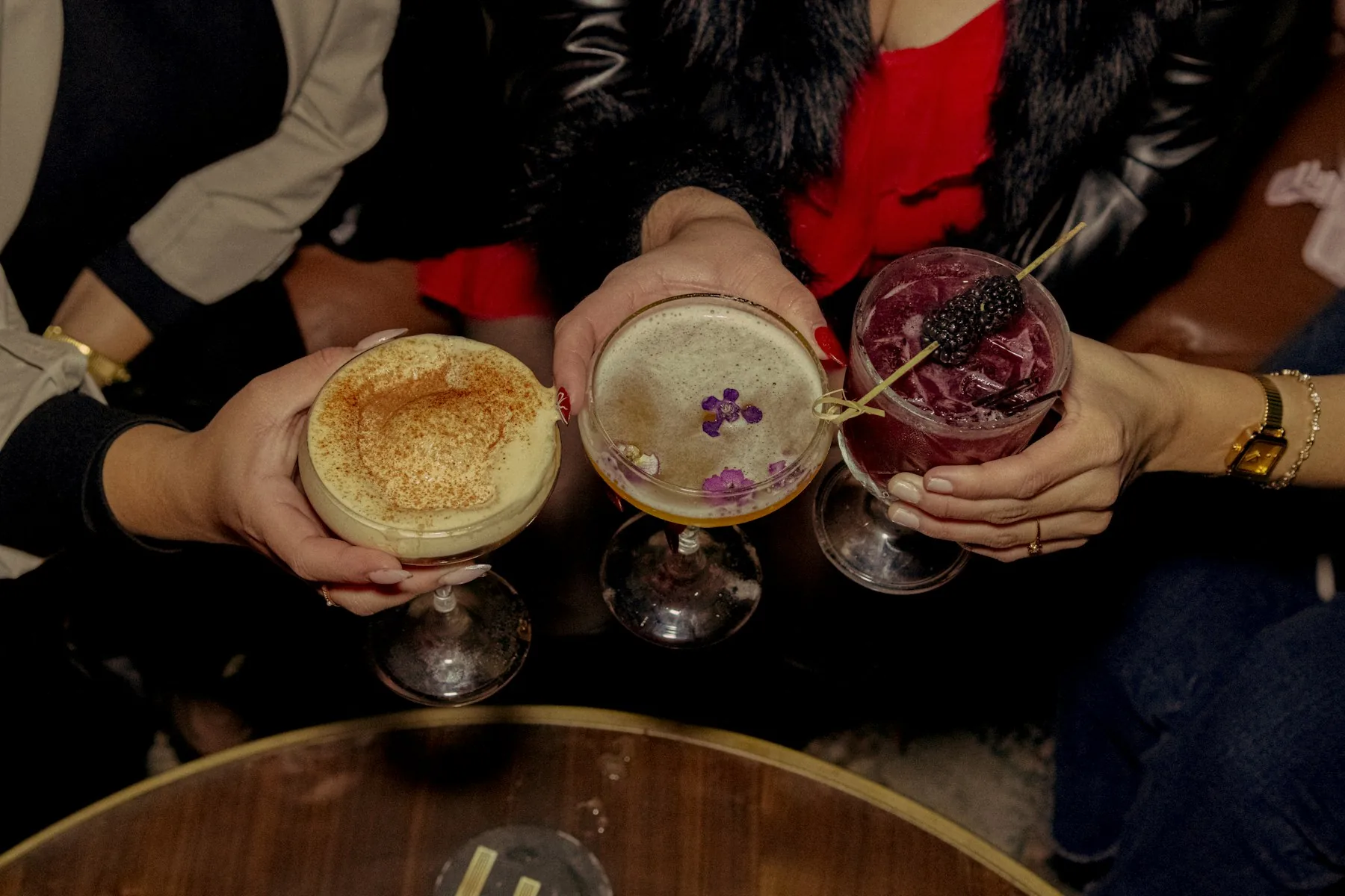 Guests toasting a special occasion with cocktails